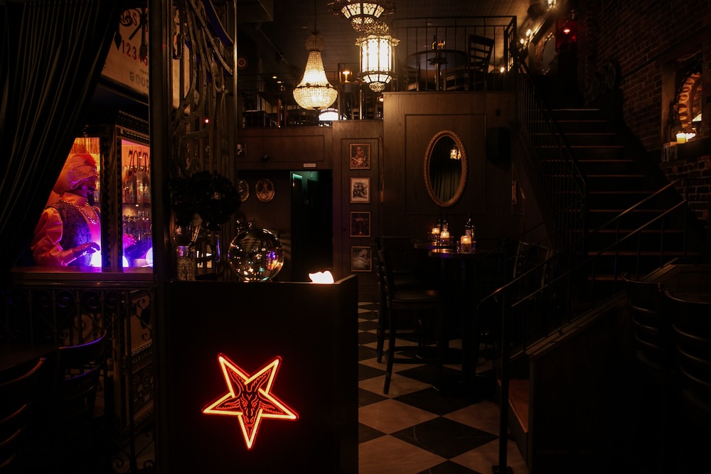 The candlelit interior of Arcana Spirit Lounge